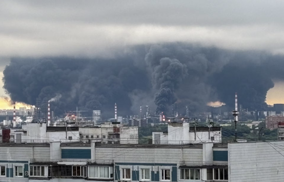 Thick plumes of smoke and flames rise from an oil refinery following a Ukrainian drone strike in Moscow, Russia on June 18, 2026